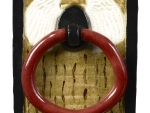 The crimson handle on the door of Enchanted Castle, close up.