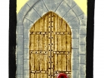 The door to The Enchanted Castle, with crimson handle.
